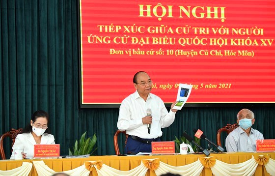 Chủ tịch nước Nguyễn Xu&acirc;n Ph&uacute;c trong buổi tiếp x&uacute;c cử tri tại huyện Củ Chi, s&aacute;ng 9-5-2021. Ảnh: VIỆT DŨNG