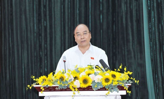 Chủ tịch nước Nguyễn Xu&acirc;n Ph&uacute;c ph&aacute;t biểu tại buổi tiếp x&uacute;c cử tri c&aacute;c quận 5, 8, 11. Ảnh: CAO THĂNG