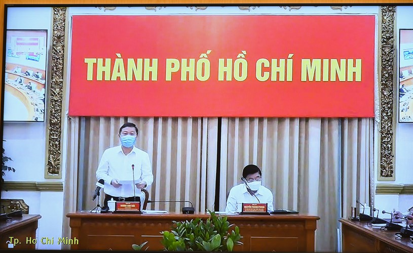 L&atilde;nh đạo th&agrave;nh phố Hồ Ch&iacute; Minh b&aacute;o c&aacute;o t&igrave;nh h&igrave;nh dịch bệnh tr&ecirc;n địa b&agrave;n. Ảnh: Quang Hiếu